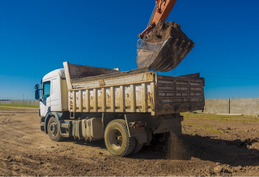 A dump truck, one of the CMVs that can be used on a construction site with a CDL